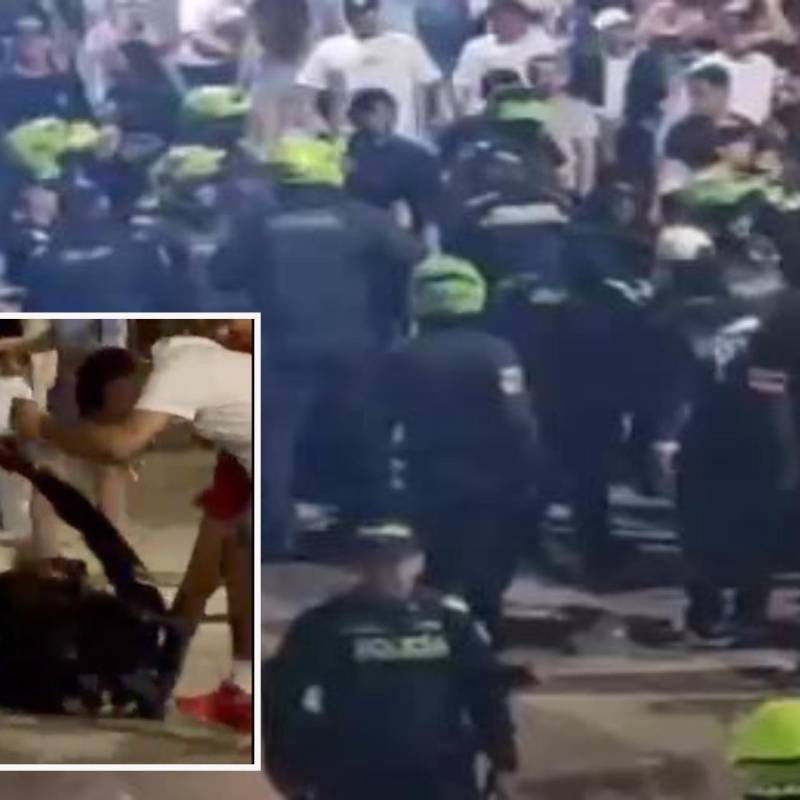 Adelante, el forcejeo en el que se habría accionado un arma de dotación. Atrás, la Policía enfrenta a los desadaptados. FOTO: Cortesía