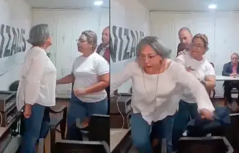 Este es el momento en el que la delegada Martha Tobón es empujada. FOTO CAPTURA DE PANTALLA