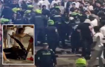 Adelante, el forcejeo en el que se habría accionado un arma de dotación. Atrás, la Policía enfrenta a los desadaptados. FOTO: Cortesía