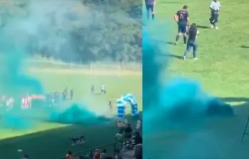 En medio de los actos protocolarios de un partido de fútbol, personas encendieron un artefacto pensando que eran bengalas y resultó gas lacrimógeno. Foto: Captura de video