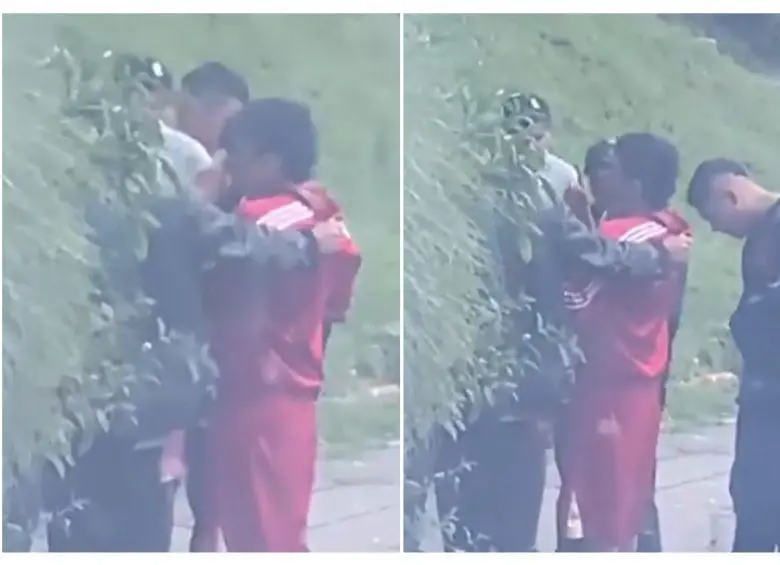 El menor de 16 años, Harold Aroca García, vestido de sudadera roja, fue grabado siendo intimidado por varios hombres. Este sería el último video del joven con vida antes de ser asesinado en Bogotá. FOTO: CAPTURA DE VIDEO