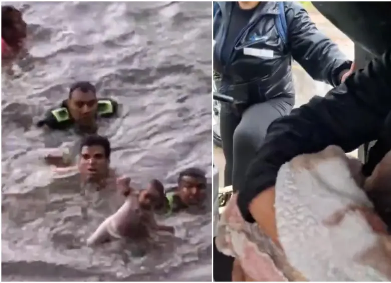 Los uniformados en medio del rescate de la bebé y su madre. FOTO: Captura video redes sociales @ColombiaOscura Los uniformados en medio del rescate de la bebé y su madre. FOTO: Captura video redes sociales @ColombiaOscura