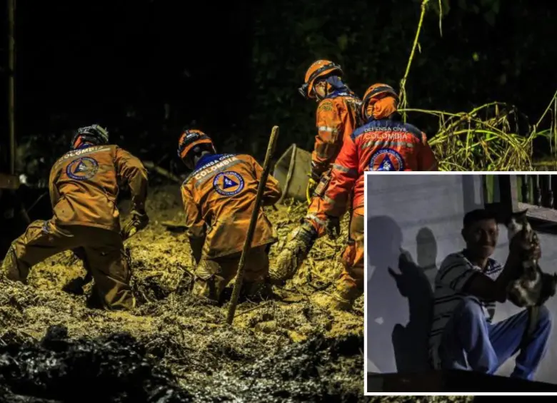Adelante, uno de los vecinos de San Isidro en Sabaneta junto a una gatica que se salvó de la avalancha. Atrás, miembros de la Defensa Civil durante las labores de búsqueda. Fotos: Andrés Camilo Suárez Echeverry