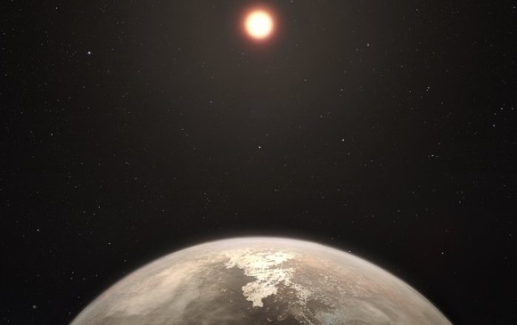 Esta recreación artística muestra al planeta templado Ross 128 b, con su estrella enana roja anfitriona al fondo. FOTO: ESO/M. Kornmesser.