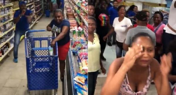 Momentos en que la mujer corre con el carrito de compras, mientras que otros usuarios le gritan con desespero. FOTO CAPTURA VIDEO