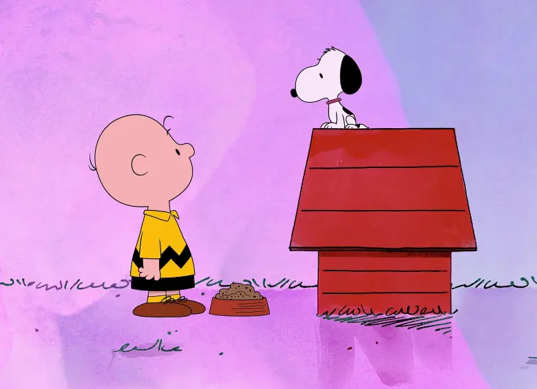 Charlie y Snoopy, dos personajes entrañables de las historietas norteamericanas. FOTO: Cortesía Apple TV.