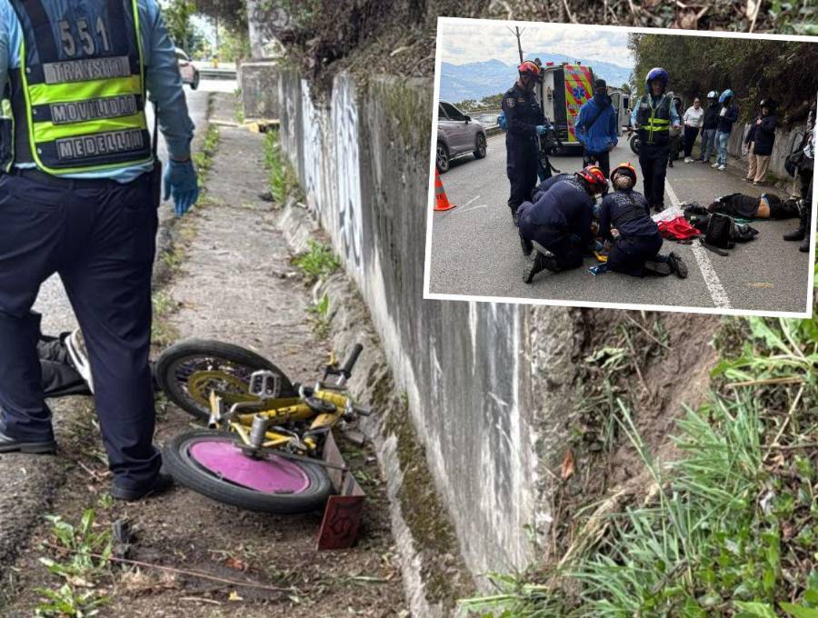Un hombre y una mujer se descolgaban en una bicicleta y golpearon contra el barranco y el pavimento. Agentes de la Policía Judicial de la Secretaría de Movilidad de Envigado atienden el accidente. FOTOS: CORTESÍA