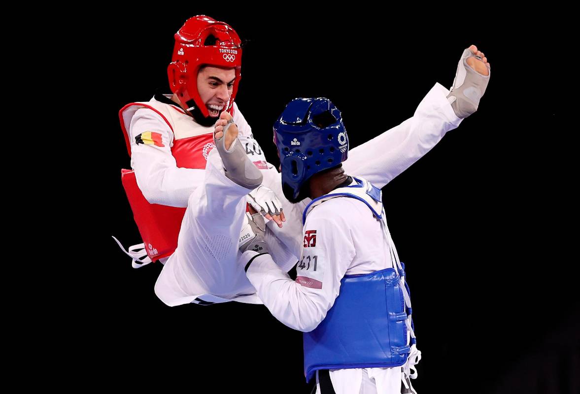 Jaouad Achab del equipo de Bélgica compite contra Bernardo Pie del equipo de República Dominicana durante la ronda de 16 de taekwondo masculino de -68 kg. Foto Getty 