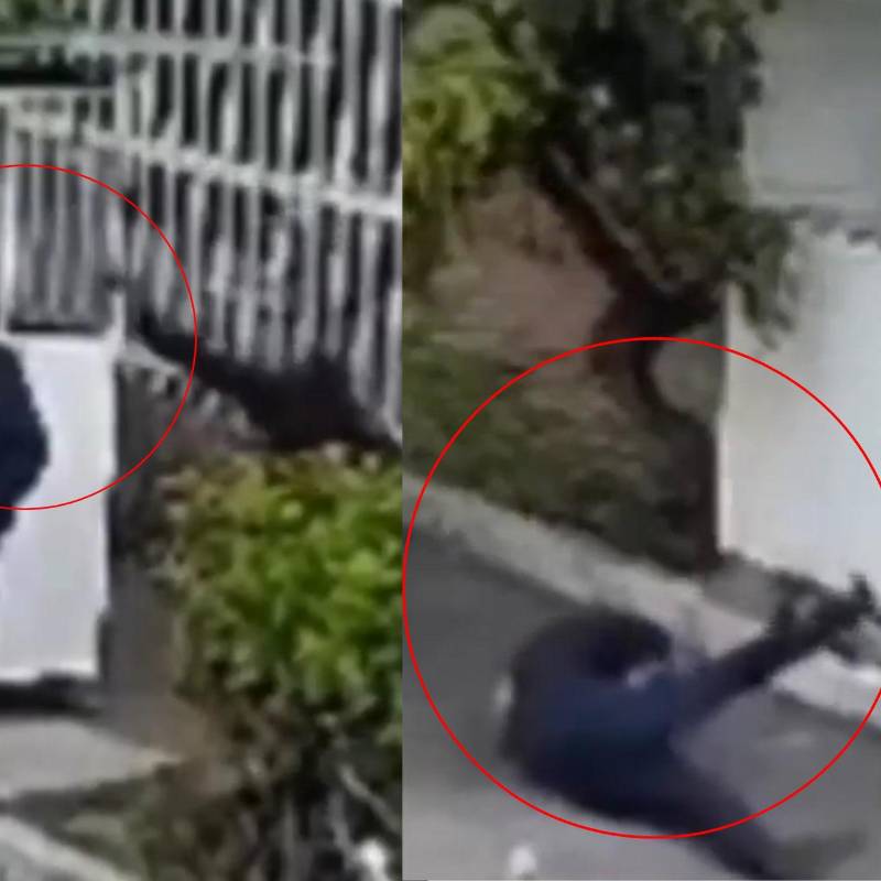 Momento en el que el hombre golpea con una piedra al vigilante en Modelia, Bogotá. Foto: captura de video @ColombiaOscura