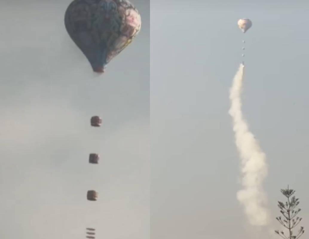 Uno de los globos cargados con pólvora que sobrevoló Itagüí durante la madrugada del 31 de diciembre, una práctica prohibida por el alto riesgo de incendio. FOTO: Redes sociales. 