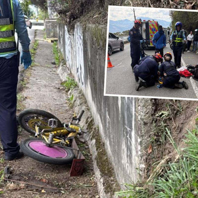Un hombre y una mujer se descolgaban en una bicicleta y golpearon contra el barranco y el pavimento. Agentes de la Policía Judicial de la Secretaría de Movilidad de Envigado atienden el accidente. FOTOS: CORTESÍA