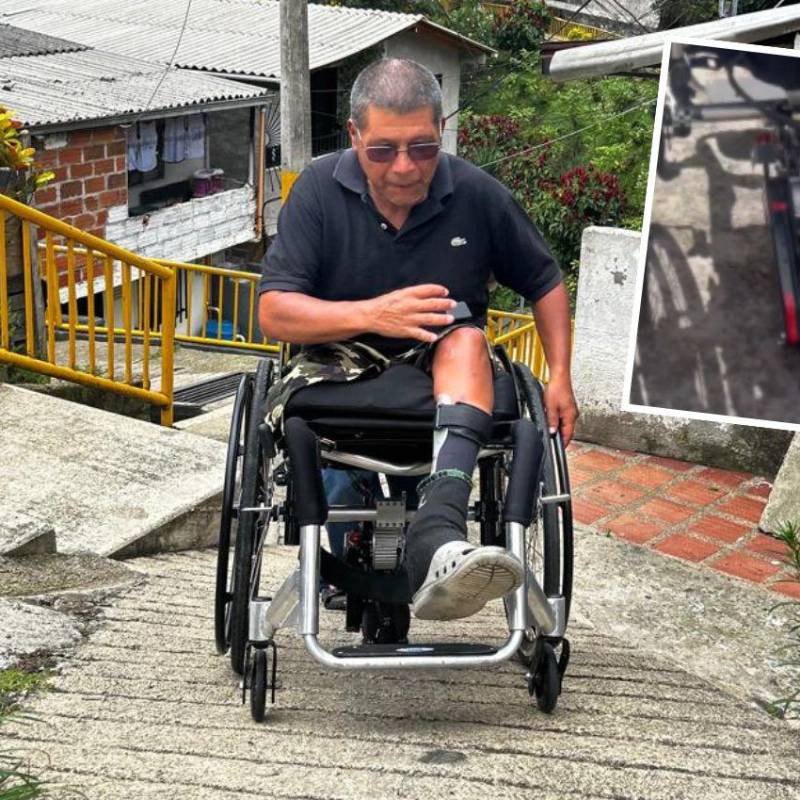 Héctor León Muñoz, de 56 años, pudo cumplir su sueño de poderse mover libremente con su silla de ruedas por las calles de San Antonio de Prado. Un motor con ruedas (detalle) que le adecuaron le permite subir las pendientes más inclinadas. FOTO: FAISURY SÁNCHEZ ARREDONDO