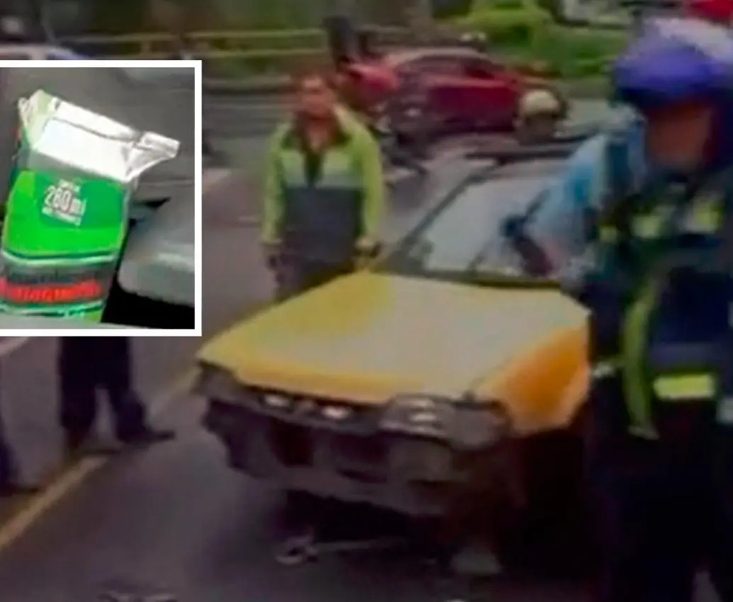 El conductor de este vehículo amarillo se le encontró una caja de aguardiente al lado de su asiento. Cuando le iban a inmovilizar el carro, arrolló a un agente de tránsito. FOTO: CORTESÍA