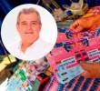 Adelante, el ex directivo y político Rubén Callejas, envuelto en la polémica. Atrás, una venta de lotería. FOTO: Camilo Suárez