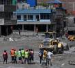 Equipos de emergencia trabajan en las zonas afectadas por las inundaciones en Nepal, mientras continúan las labores de búsqueda de desaparecidos tras la tragedia en el Himalaya. FOTO: AFP.