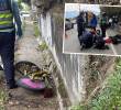 Un hombre y una mujer se descolgaban en una bicicleta y golpearon contra el barranco y el pavimento. Agentes de la Policía Judicial de la Secretaría de Movilidad de Envigado atienden el accidente. FOTOS: CORTESÍA