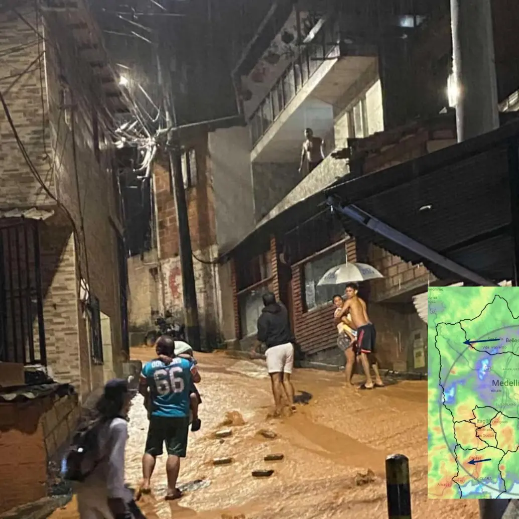 Adelante, las fuertes lluvias que se extendieron hasta la madrugada de este lunes. Atrás, uno de los sectores de Itagüí inundado por las precipitaciones. FOTO: Cortesía.