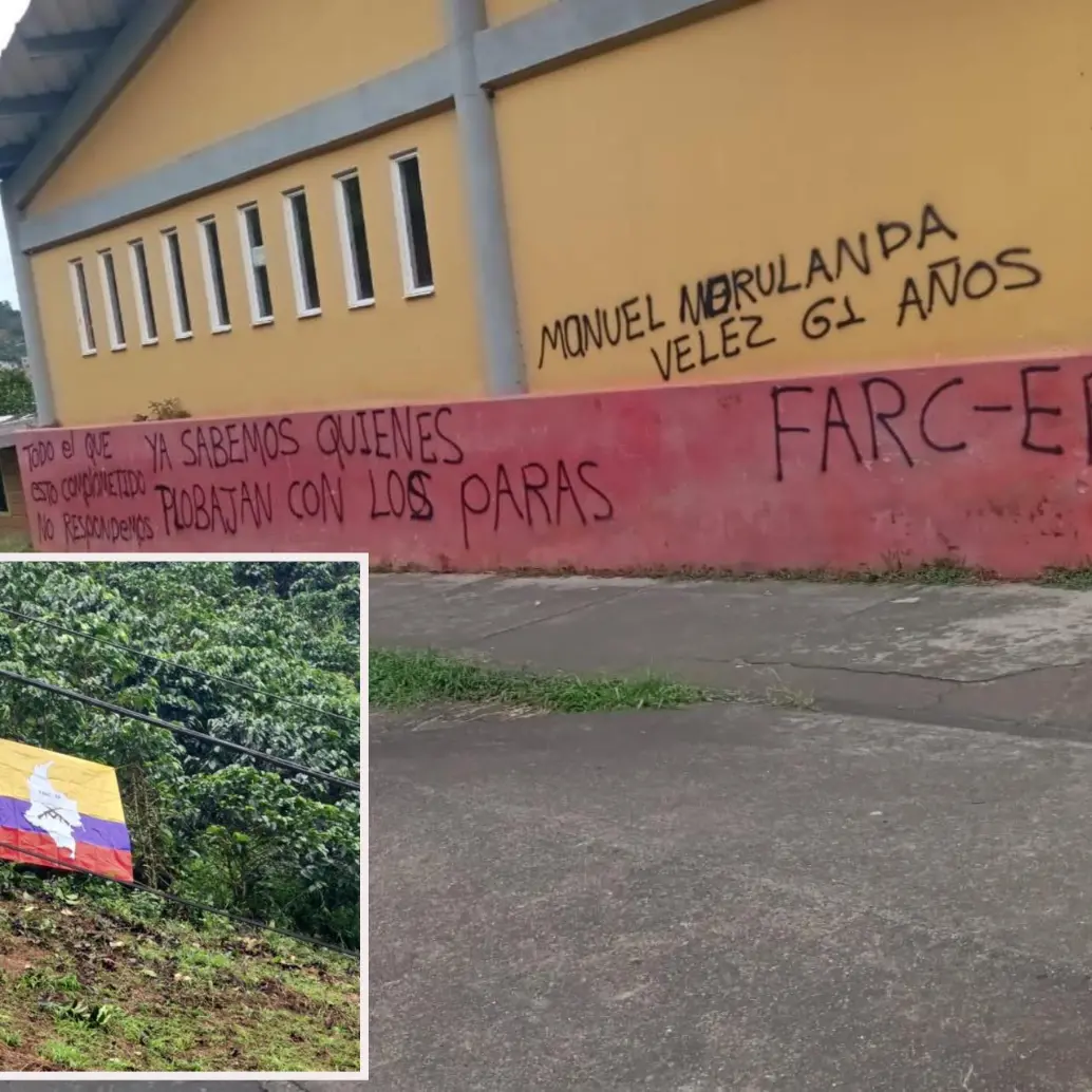 La bandera y las paredes pintadas por al parecer miembros de las Disidencias en Betulia. FOTO: Cortesía Denuncias Antioquia.