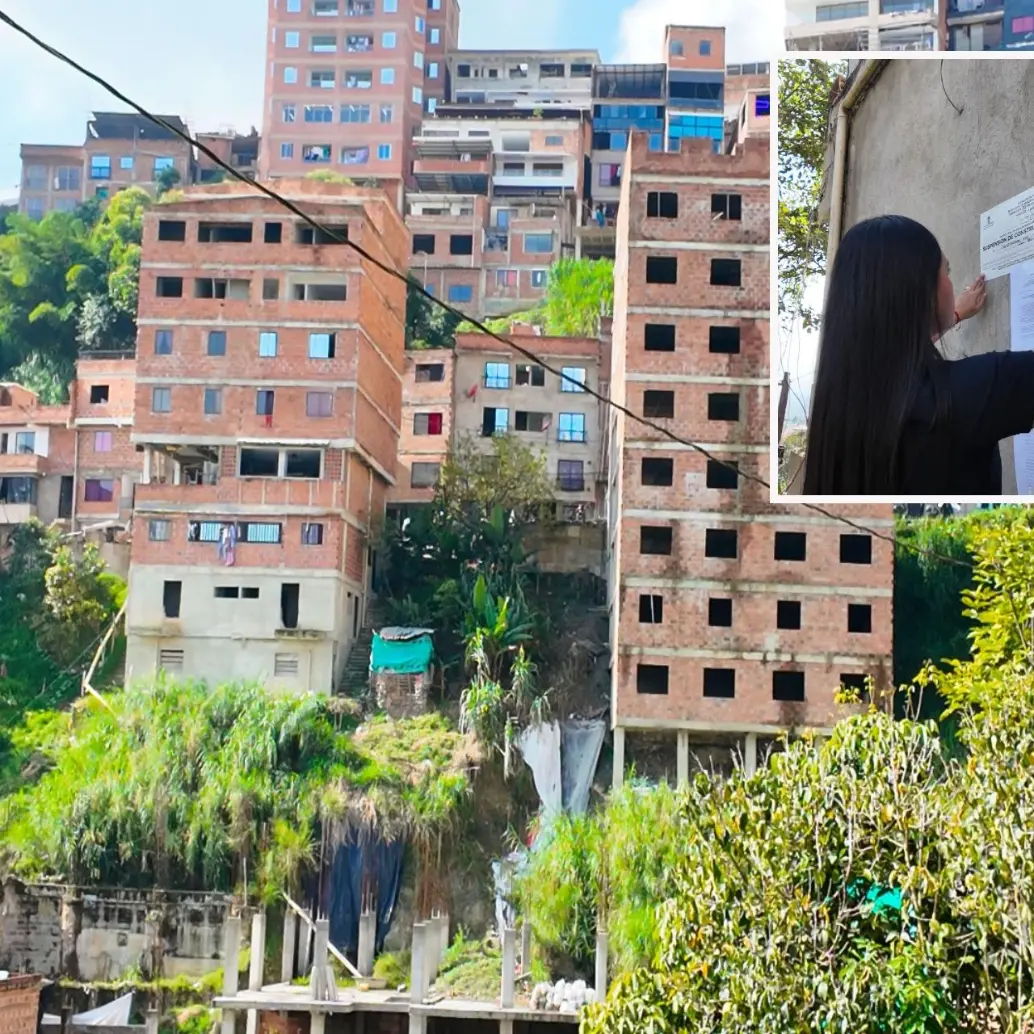 Adelante, una funcionaria realizando un sellamiento. Atrás,algunas de las viviendas investigadas. FOTO: Cortesía