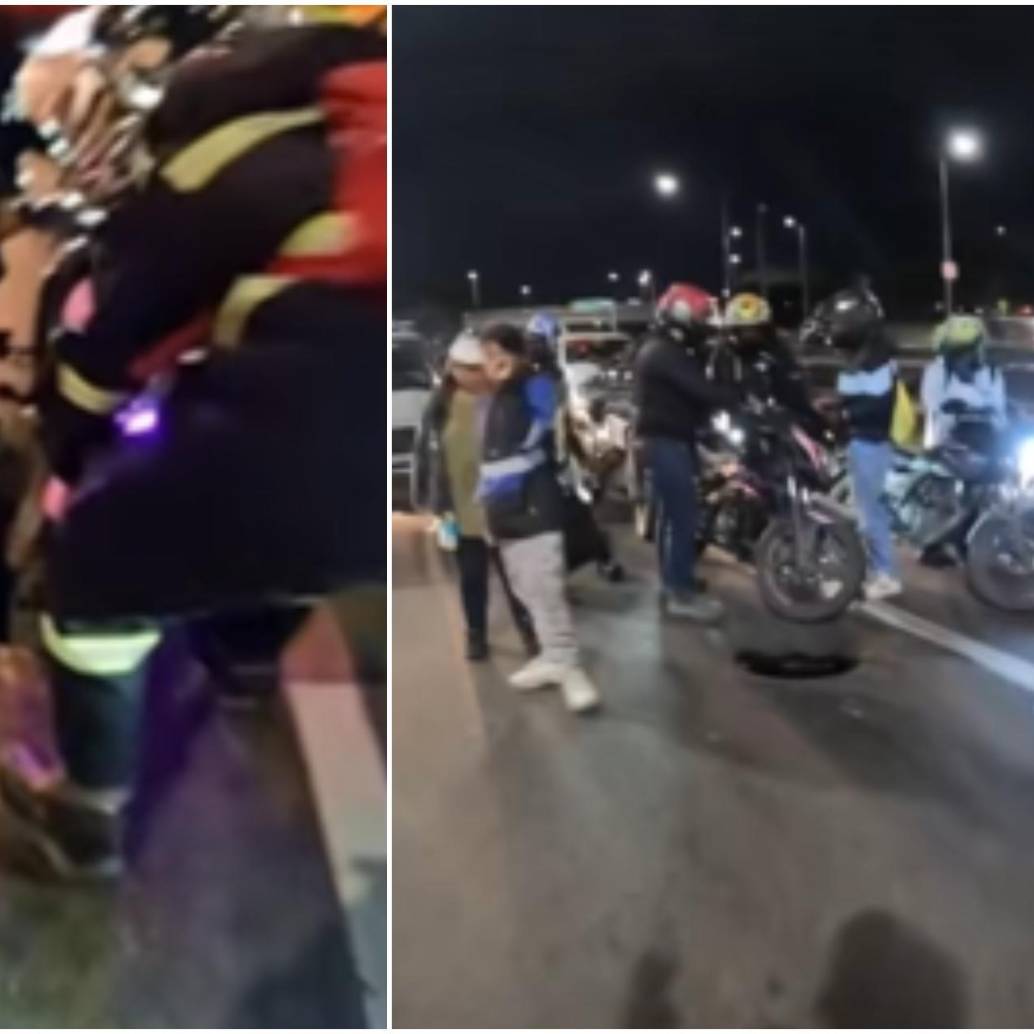 Momento en el que varios ciudadanos se detuvieron a ayudar a la motociclista afectada, para atenderla y ayudarle a sacar la moto del hueco. FOTO: Captura video @santiagolopezp