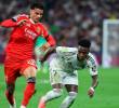 Richard Ríos junto a Vinícius Júnior en el partido entre el Real Madrid y el Benfica. FOTO GETTY