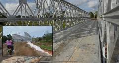 Adelante, usuarios cruzando el puente. Atrás, aspectos de la estructura de 49 metros. FOTO: Cortesía e imagen tomada de redes