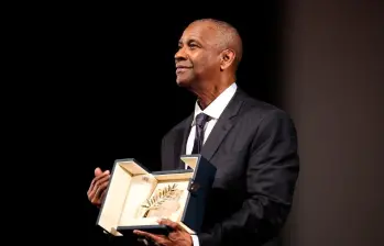 Denzel Washington fue homenajeado con una Palma de Oro sorpresa en el Festival de Cannes 2025. FOTO AFP