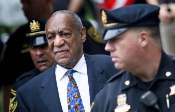 (FILES) US actor Bill Cosby arrives at court on September 24, 2018 in Norristown, Pennsylvania to face sentencing for sexual assault. A woman who said she was drugged and sexually assaulted by veteran US entertainer Bill Cosby was awarded more than $19 million on March 23, 2026 after a civil hearing in California. Donna Motsinger said she was working as a waitress more than 50 years ago when the performer began to target her. (Photo by Brendan Smialowski / AFP)