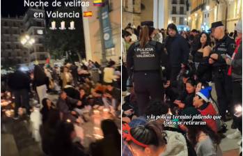 Una gran cantidad de colombianos celebrando el día de las velitas en la Plaza de la Virgen en Valencia, España. FOTO: Captura video redes sociales @soypaomorenooo