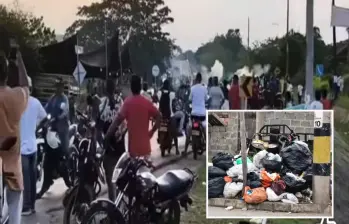 Adelante, basuras acumuladas en Caucasia. Atrás, un bloqueo en una de las vías. FOTO: imagen tomada de redes.