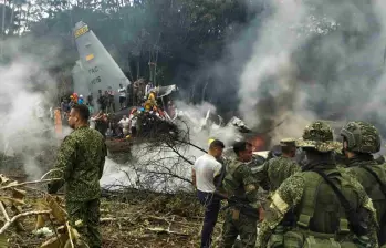Los cuerpos de las víctimas del accidente del Hércules fueron trasladados a Bogotá para su identificación y entrega a las familias. FOTO: AFP. 