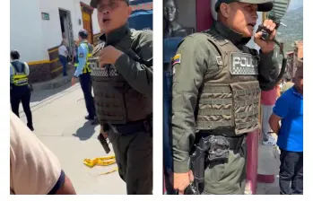 El subcomandante de la Policía de Amagá, en una acalorada discusión con los presentes en el evento. FOTO Cortesía. 