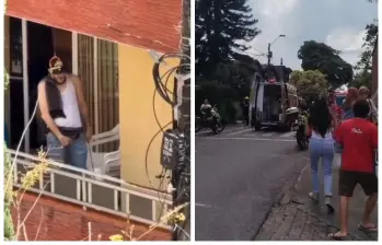 Desde su balcón, este hombre, quien portaba un machete en su mano izquierda, incitaba a los vecinos a que subieran a su casa para enfrentarlos. FOTO captura video de redes sociales.