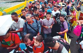Venezuela registra el mayor éxodo en la historia de América Latina: 7,7 millones de migrantes y refugiados. Más del 80 % de la población vive en pobreza multidimensional, según la Encuesta Nacional de Condiciones de Vida (Encovi). Y por eso se escaparon de ese país más de 7,7 millones de ciudadanos. FOTO AFP 