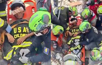 El equipo Usar Col-1, que tiene entre sus integrantes a ocho integrantes del Cuerpo de Bomberos de Envigado, rescataron a Moises, un niño de 11 años, en La Guaira. FOTOS: TOMADAS DE VIDEO