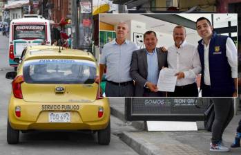 Adelante, firma del acuerdo entre municipios. Atrás, un taxi del municipio de Rionegro. Foto: Manuel Saldarriaga Quintero