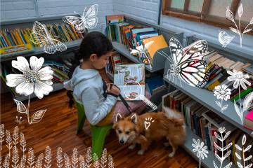 Janna, 11 años, y su amigo Simba en la Biblioteca Comunitaria Sueños de Papel, en Manrique, La Cruz. Foto: Esneyder Gutiérrez.