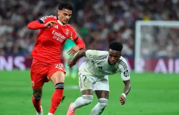 Richard Ríos junto a Vinícius Júnior en el partido entre el Real Madrid y el Benfica. FOTO GETTY