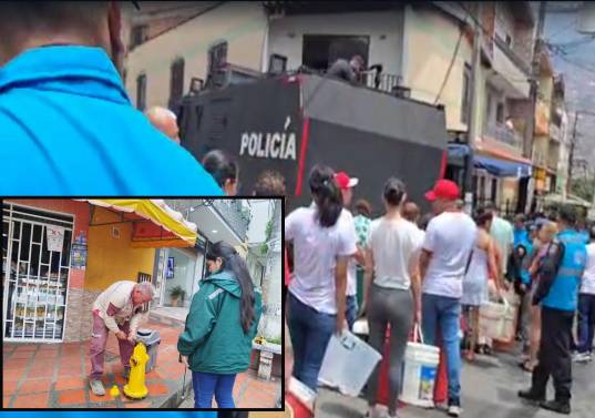 Adelante, funcionarios de EPM habilitando hidrantes para brindarle agua a la gente. Atrás, una tanqueta de la Policía realiza entrega de agua a habitantes del Aburrá. FOTOS: Cortesía EPM y Policía Metropolitana