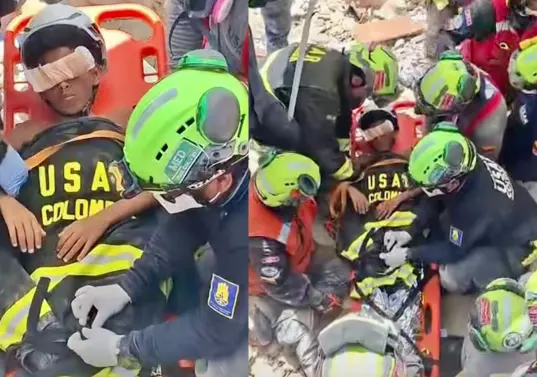 El equipo Usar Col-1, que tiene entre sus integrantes a ocho integrantes del Cuerpo de Bomberos de Envigado, rescataron a Moises, un niño de 11 años, en La Guaira. FOTOS: TOMADAS DE VIDEO