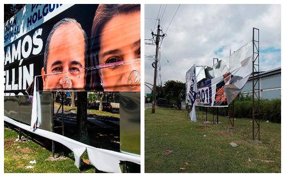 La valla de Paola Holguín y Juan Espinal ha sido atacada diez veces. A la derecha, la de Víctor Correa, que fue dañada con cuchillo. Foto: EL COLOMBIANO. 