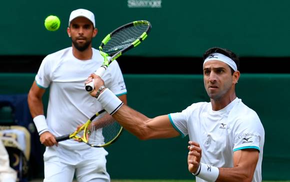 Farah (derecha) y Cabal hacen parte del listado de favoritos para triunfar en la cita de Australia. En su última participación allí quedaron sorpresivamente eliminados en primera ronda FOTO ARCHIVO AFP