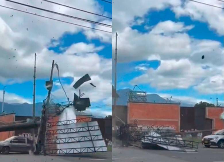 Un Twingo casi es aplastado por una valla publicitaria en Armenia. Foto: Pantallazos de video de Twitter @juanseriosm. 