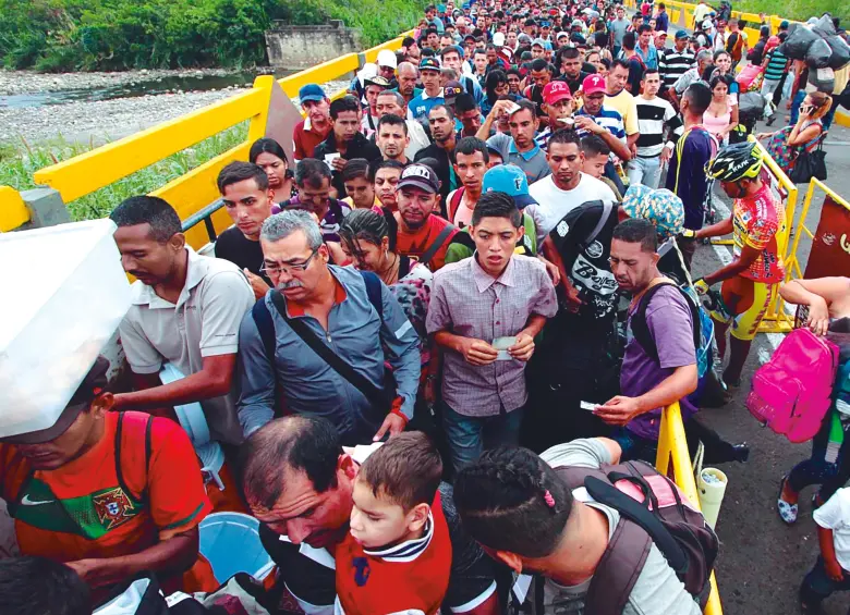 Venezuela registra el mayor éxodo en la historia de América Latina: 7,7 millones de migrantes y refugiados. Más del 80 % de la población vive en pobreza multidimensional, según la Encuesta Nacional de Condiciones de Vida (Encovi). Y por eso se escaparon de ese país más de 7,7 millones de ciudadanos. FOTO AFP 