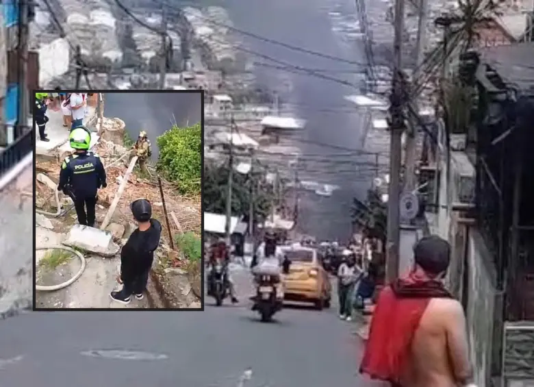 Adelante, organismos de socorro atendiendo el incendio. Atrás, humareda vista en el barrio. FOTO: Cortesía Denuncias Antioquia