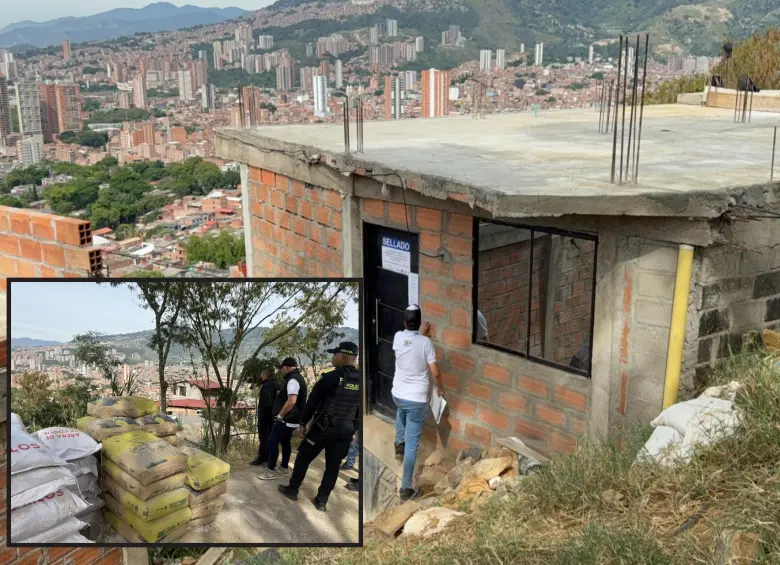 Adelante, parte del material que fue incautado y destruido por las autoridades. Atrás, una de las viviendas ilegales que se alzan en la zona. FOTO: Cortesía