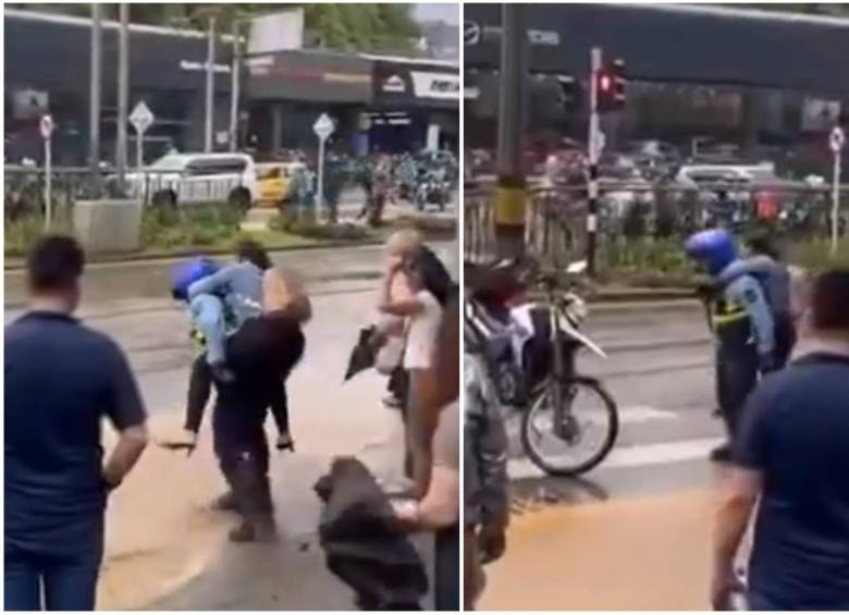 En las imágenes quedó evidenciado cómo el agente cargó a una mujer para que no se ensuciara y pudiera pasar la calle, haciendo esto, según testigos, con más personas en el lugar. FOTO: Captura video de redes sociales @FicoGutierrez