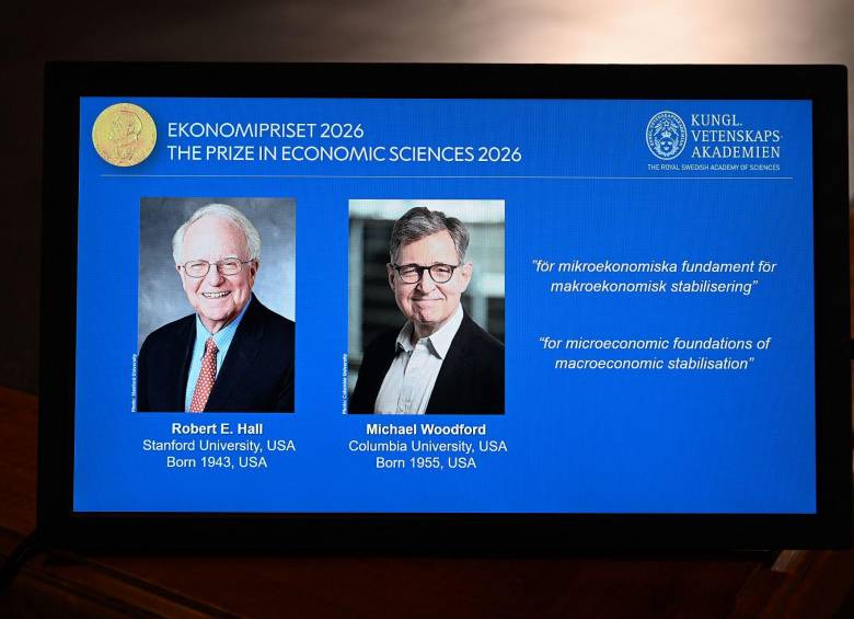 Robert Hall y Michael Woodford recibieron el último Nobel de la temporada. Foto: AFP