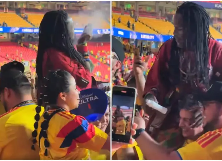 Los hinchas colombianos bailando y celebrando con el brujo de Ghana mientras lo cargaban en las gradas. FOTO: Captura de video de redes sociales 