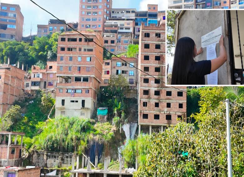 Adelante, una funcionaria realizando un sellamiento. Atrás,algunas de las viviendas investigadas. FOTO: Cortesía